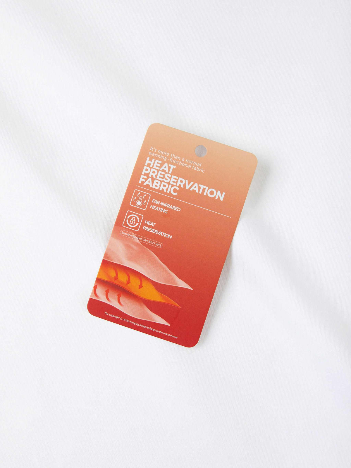 Heat preservation fabric tag highlighting far-infrared heating and warmth retention for modern apparel